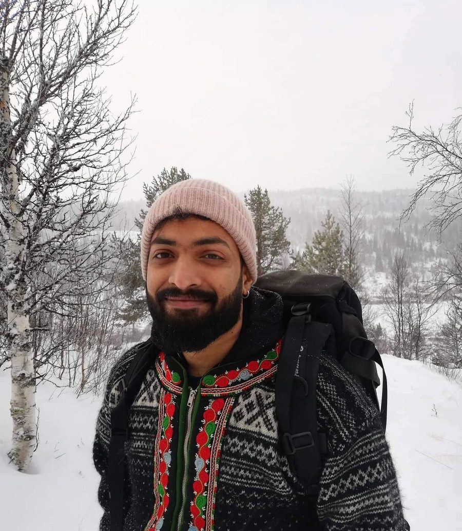 Arjun Ajith hiking in the snow in Møre og Romsdal, Norway